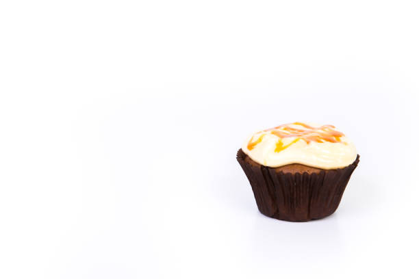 Sweet dessert, cupcake with butter cream isolated on white background.