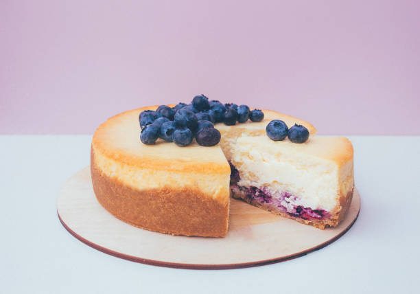 istock a cut of cake with whipped cream on the table background. 1174902557