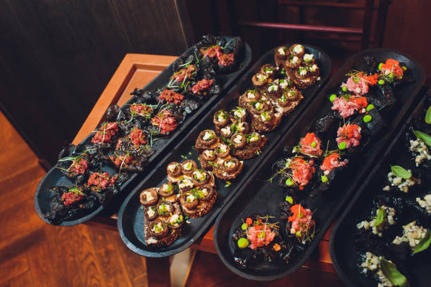 istock crackers with cream cheese and black caviar, horizontal. 1174902616