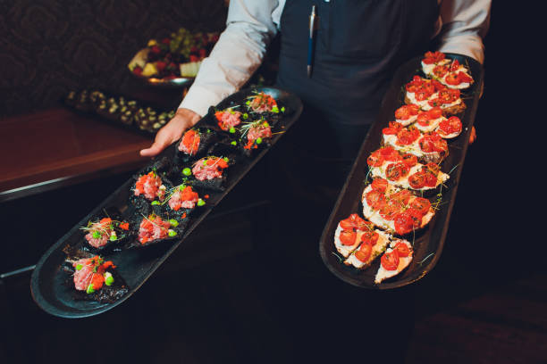 istock crackers with cream cheese and black caviar, horizontal. 1174902637