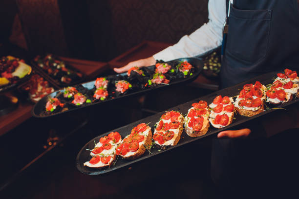 istock crackers with cream cheese and black caviar, horizontal. 1174902646