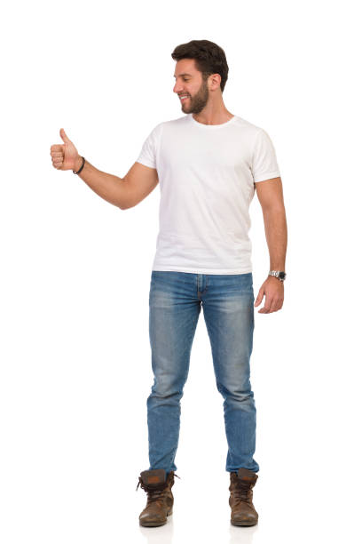 istock Handsome Man Is Standing, Showing Thumb Up And Looking Away. Front View. 1174902706