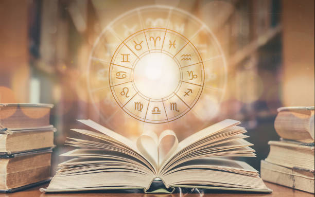 Love horoscope, zodiac sign astrology for foretell and fortune telling education study course concept with horoscopic wheel over old love story book in school library Love horoscope, zodiac sign astrology for foretell and fortune telling education study course concept with horoscopic wheel over old love story book in school library alternative medicine photos stock pictures, royalty-free photos & images