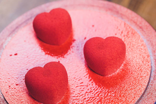 istock Confectioner decorates the cake with velour using the spray gun. 1174902771