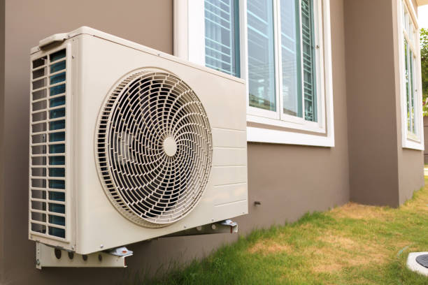 istock Air conditioner compressor outdoor unit installed outside the house 1174904365