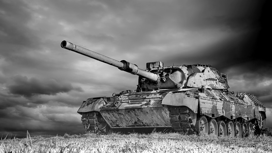 Old german Leopard battle tank driving through the desert