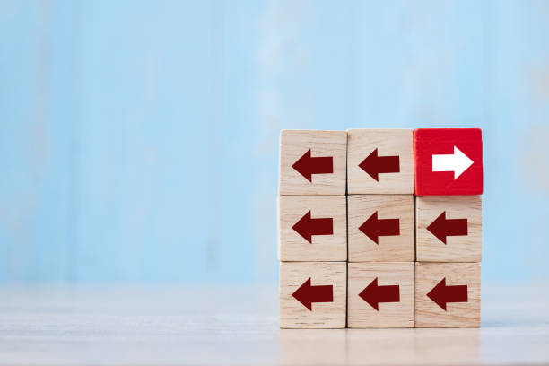 istock Red block with different direction of arrow on table background. Business Growth, Improvement, strategy, Successful, different and Unique Concepts 1174908224