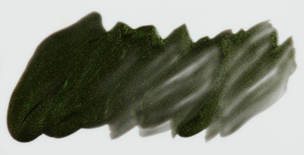 istock Sparkle green paint stain isolated 1174917608
