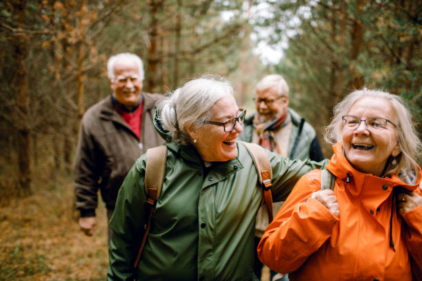 istock Seniors hiking through the foerst 1174919454
