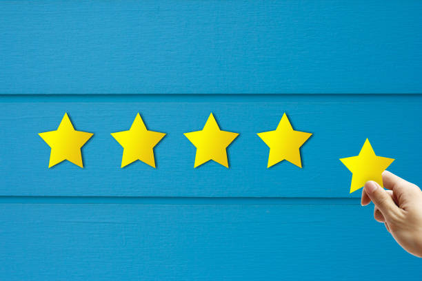 istock Customer Feedback Concept : Hand holding and giving yellow star for best service ranking. 1174921779
