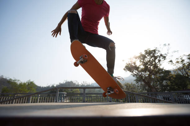 istock Skateboarder skateboarding at skatepark ramp 1174923000