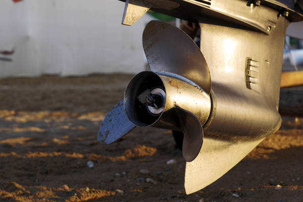 closeup of outboard motor's steel propeller - skeg imagens e fotografias de stock