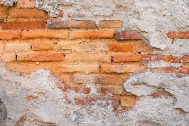 istock Old orange brick wall texture.Rough surface of old white plaster grunge wall with orange brickwall decoration , copy space use for background. 1174924257