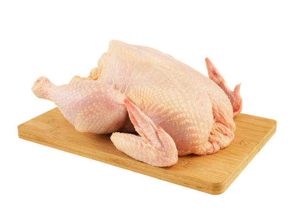 istock Raw chicken on board isolated on white 1174927361