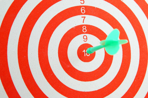 istock Red and white shooting target and arrow 1174928300