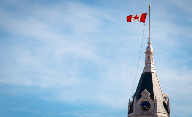 Canadian Flag Atop a Clock Tower