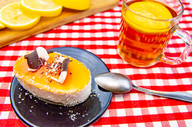 istock Cream cake with lemon tea on the table. 1174928326