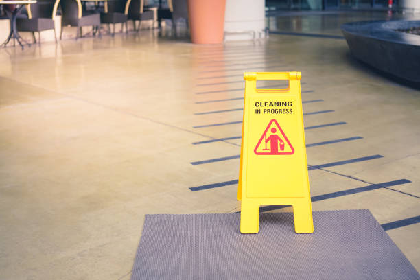 istock yellow plastic cleaning in progress sign on floor 1174929261