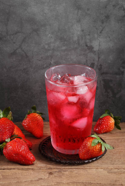 istock strawberry cocktail and strawberry on wooden table with a blank space for a text, Fruit in kitchen background 1174933376