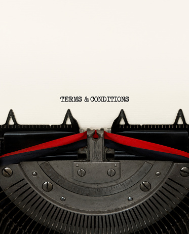 Terms and conditions typed on vintage typewriter.
