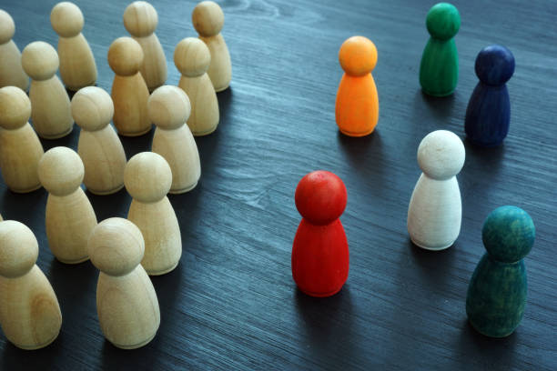istock Diversity and Inclusion concept. Wooden and colored figurines. 1174940279