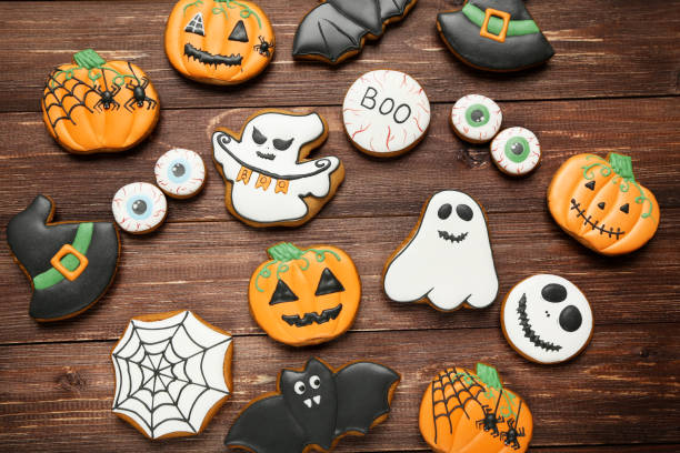 istock Halloween gingerbread cookies on brown wooden table 1174940282
