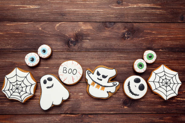 istock Halloween gingerbread cookies on brown wooden table 1174940329