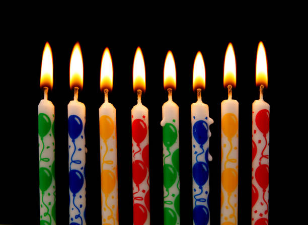 istock Burning birthday candles on black 1174941286