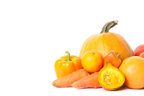 Pumpkins, oranges, carrot and peppers isolated on white background