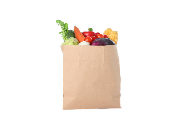 istock Paper bag with different vegetables isolated on white background 1174945000