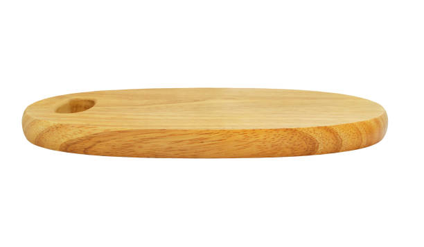 istock Wooden cutting board isolated on white background 1174946317