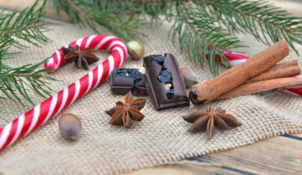 istock spices, candy canes and chocolat put on a  natural textil  in christmas decoration 1174948116