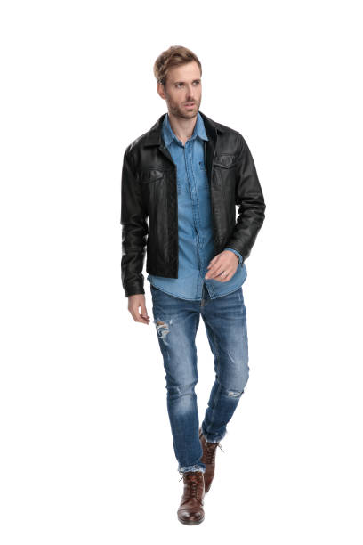 istock man walking and looking away serious 1174948140