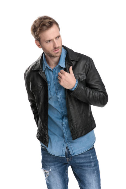 istock man holding his collar and looking away 1174948213