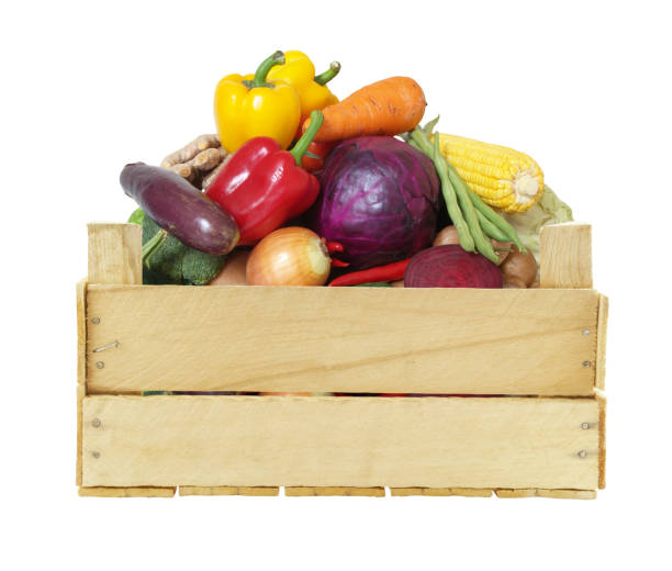 istock Vegetables in wooden crate isolated on white 1174949537