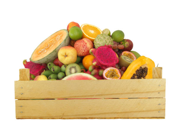 istock Fruits in wooden crate isolated on white 1174950471