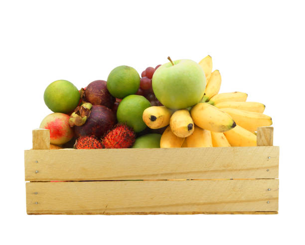 istock Fruits in wooden crate isolated on white 1174950524