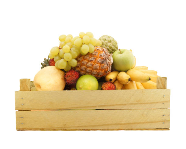 istock Fruits in wooden crate isolated on white 1174950540
