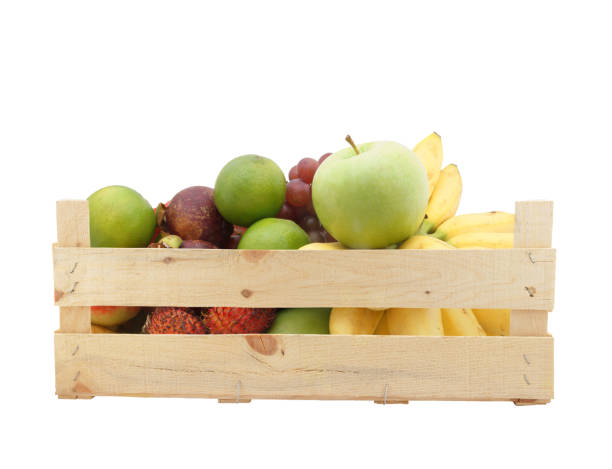 istock Fruits in wooden crate isolated on white 1174950591