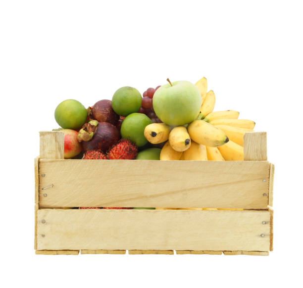 istock Fruits in wooden crate isolated on white 1174950643