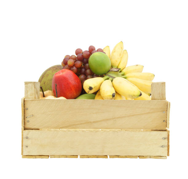 istock Fruits in wooden crate isolated on white 1174950700