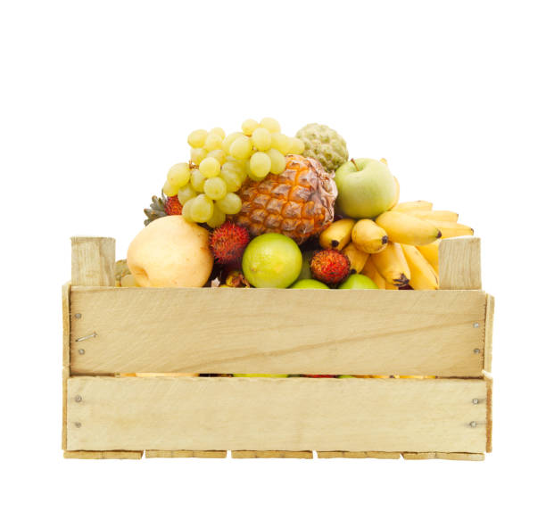 istock Fruits in wooden crate isolated on white 1174950702