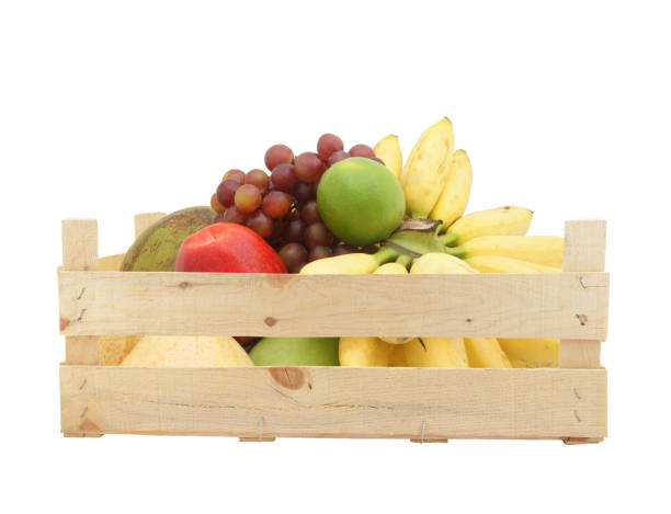 istock Fruits in wooden crate isolated on white 1174950745