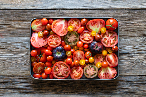 Tomatoes composition varied tomato on table wooden board
