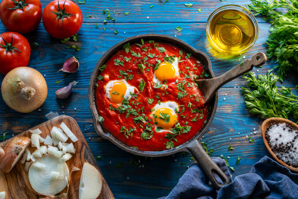 Shakshouka poached eggs on spicy tomato sauce recipe