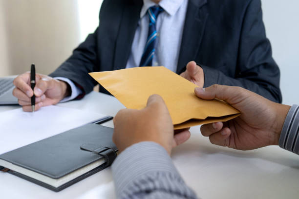 istock Business man give bribe 1174958398