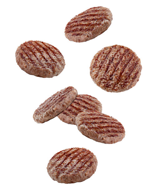 falling grilled hamburger meat isolated on white background, clipping path, full depth of field - barbecue grill barbecue burger hamburger imagens e fotografias de stock