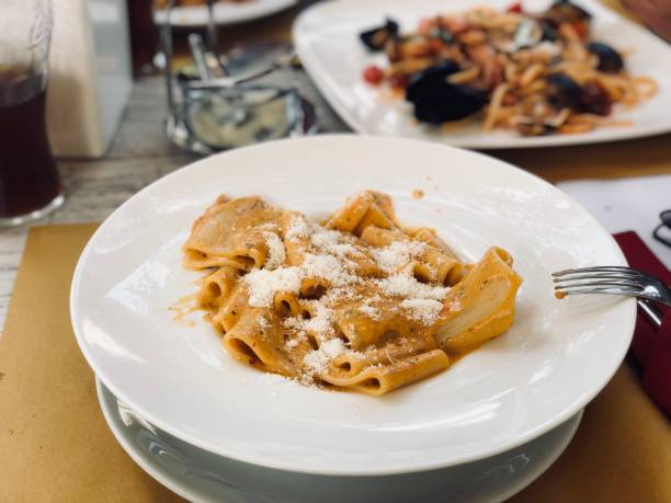 istock Italian pasta with sauce and parmesan 1174965870