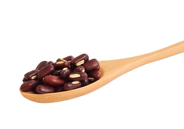 istock Kidney Beans in Wooden Spoon on White Background 1174965875