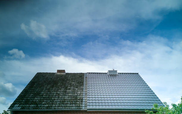 A half cleaned house roof shows the before and after effect of a roof cleaning. A half cleaned house roof shows the before and after effect of a roof cleaning. before and after photos stock pictures, royalty-free photos & images